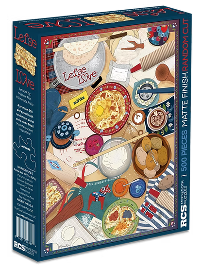 Discover the warmth of Scandinavian tradition with the Lefse Love 500 PC Puzzle, featuring a vibrant overhead illustration of a breakfast table set with pancakes, butter, tea, jam, utensils, and a tartan cloth—all celebrating “Lefse Love.” This delightful puzzle brings cozy charm to your home. Box indicates 500 pieces.