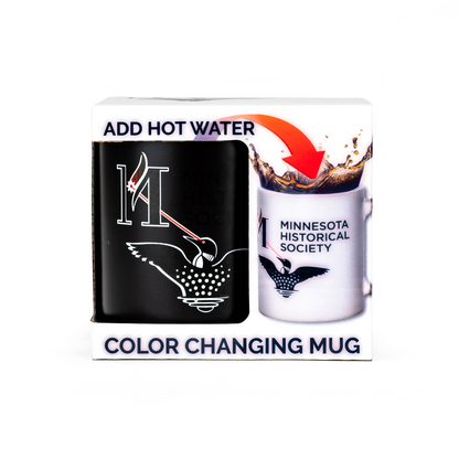 Packaging for the Laser Loon Mug Color Changing features a black mug that turns white with hot water, unveiling the Minnesota Historical Society logo alongside the iconic Laser Loon design. The text reads: Add Hot Water and Color Changing Mug.