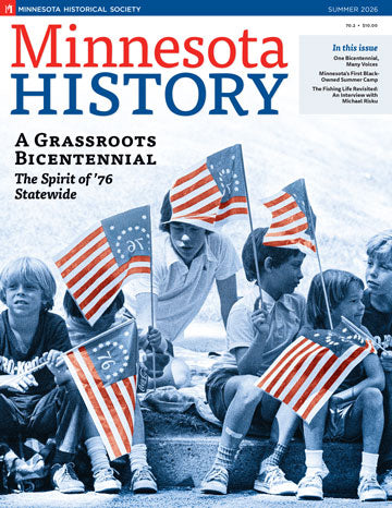 Five children sit on a curb holding American flags, dressed in casual summer clothing. The cover of *Minnesota History Magazine Summer 2026 (70.2)* features the headline “A Grassroots Bicentennial—The Spirit of ’76 Statewide,” celebrating the Minnesota Bicentennial and spotlighting stories such as the Phyllis Wheatley Community Center and experiences at Black-owned summer camps.